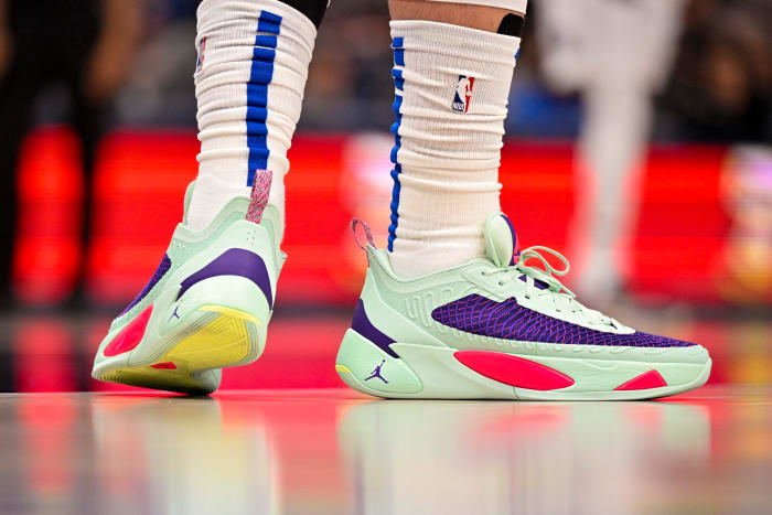 View of Luka Doncic's green and purple Jordan shoes.